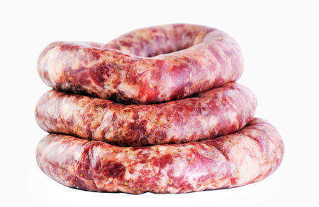 fresh raw ground meat sausages isolated on white background.の写真素材
