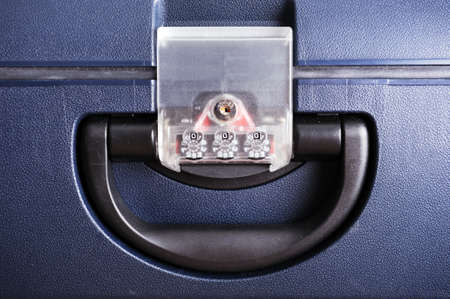 a suitcase handle with a combination lock
