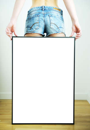 empty metal frame in the hands of a sexy girl.の写真素材