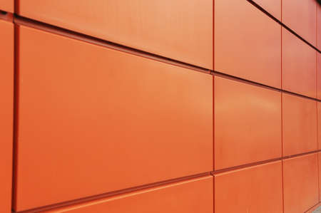 Detail shot of modern architecture facade.Texture of modern composite materials. Abstract background.The facade of the buildings is finished with a metal profile.の写真素材