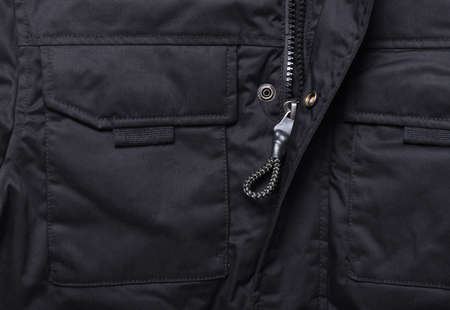 Black jacket with zipper close-up. Men's clothing background.