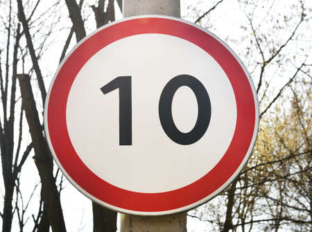 Traffic sign speed limit 10 km per hour on a street light