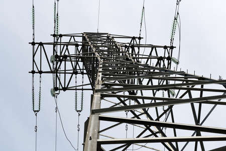 High voltage power lines and pylons. Electricity distribution station.