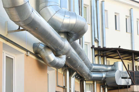 Metal pipes on the facade of a building in the city. High quality photoの写真素材