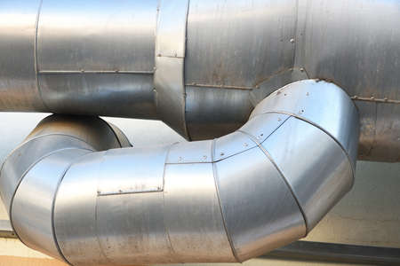 Industrial steel pipes of a water treatment plant, close-up