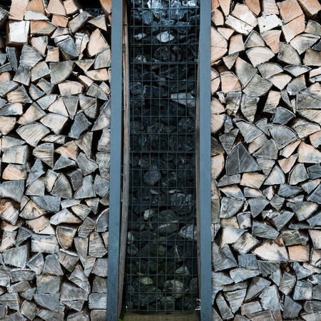 Two stacks of chopped wood next to eachother