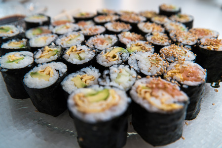 A number of sushi rolls prepared on a plateの写真素材