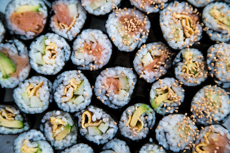 A number of sushi rolls prepared on a plateの写真素材