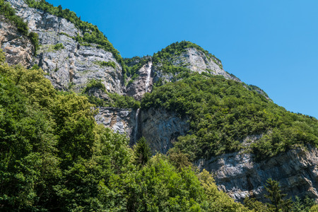 Rocks, forest and mountains in Switzerlandの写真素材
