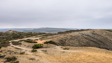 A beach between the cliffs in Portugalの写真素材