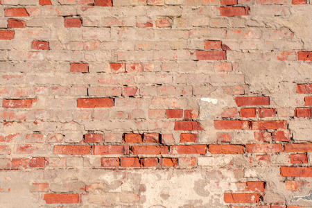 red brick wall background warm tonningの写真素材