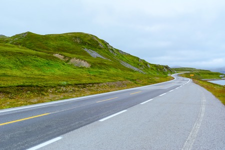 View of the road in severe nature of northern Norway in the summer