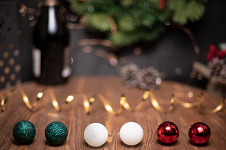 Smooth shady christmas and new year decoration background with round bokeh, golden ribbon and bottle of champagne and New Year's spheres Italy flag colorの写真素材