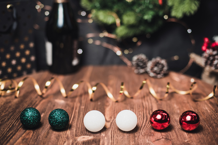 Smooth shady christmas and new year decoration background with round bokeh, golden ribbon and bottle of champagne and New Year's spheres Italy flag colorの写真素材