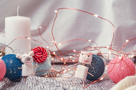 mumps small pig from marshmallows against the background of Christmas decorationの写真素材