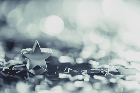 Macro photo of silver star with light bokehの写真素材