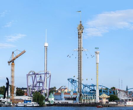 Stockholm, Sweden - August 4, 2019: View of the amusement park of Stockholm Skansen island from the gulfのeditorial素材