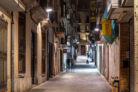 Sitges, Spain - 22 April 2018 View on the night streets of old town with shops and cafeのeditorial素材