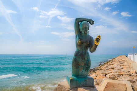 Sitges, Spain - 28 April 2018 View on the famous mermaid monument on the background of blue seaのeditorial素材