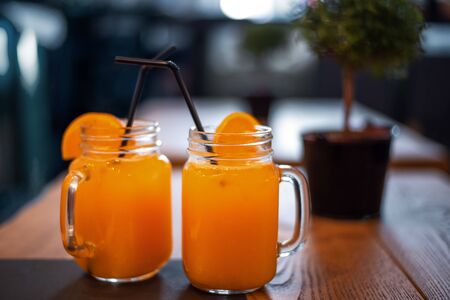 Cocktail in mug with oranges slice. Mug delicious refreshing drink of mix fruits with orange on...