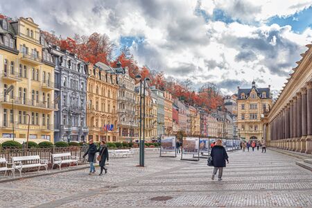 KARLOVY VARY CZECH REPUBLIC - OCTOBER 30, 2019: View on the Tepla river promenade with tourists and buildings in Karlovy Vary the most famous SPA town in the Czech Republicのeditorial素材