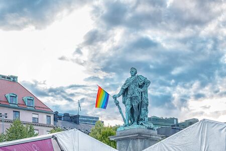 STOCKHOLM/SWEDEN - AUGUST 2, 2019: Karl XIII monument with rainbow flag in the arms during gay pride monthのeditorial素材