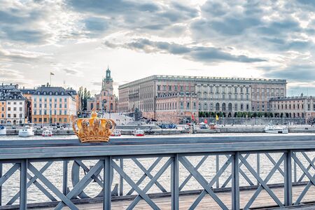 STOCKHOLM/SWEDEN - AUGUST 2, 2019: Skeppsholmsbron bridge with famous golden crown and view on Gamla stanのeditorial素材
