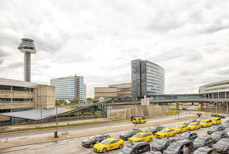Stockholm/Sweden - August 8, 2019: Wiev on a lot of black and yellow taxi cars on a parking in Arlanda airportのeditorial素材