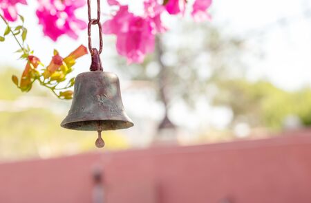 Metal ring on Beautiful purple exotic flowers Bougainvillea and lights bokeh backgroundの写真素材