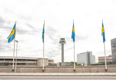 Stockholm/Sweden - August 8, 2019: Four flag stocks with sweden flags in Arlanda airportのeditorial素材