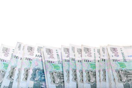 Background of banknotes of one thousand Russian rubles isolated on white laying on a surface