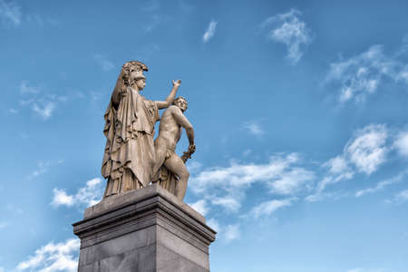 Berlin, Germany - December 9, 2019: The sculpture on the Schloss Bridge (Schlossbruecke) - Greek goddess Athena protects the young hero. By Gustav Blaeser, 1854のeditorial素材