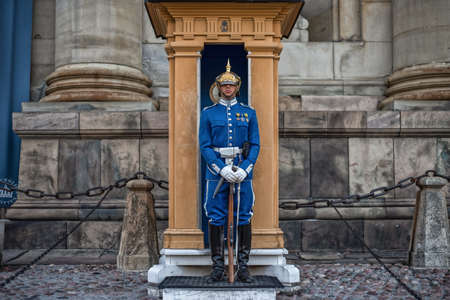 Stockholm, Sweden - August 3, 2019: Sweden Royal Guard in blue uniform protecting Royal Palace in Stockholm. Guard standing in the guard boothのeditorial素材