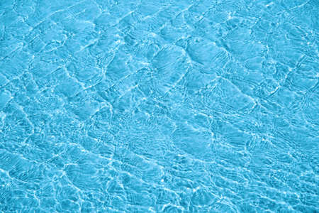 Surface of blue sea water with ripples. Water surface background, texture.の写真素材
