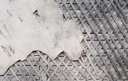 Old wooden walls with plaster crossed base. Old wooden structures with rusty nails. Wooden house...