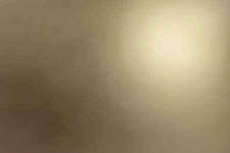 Soft defocused background of round bronzed color light gradientの写真素材