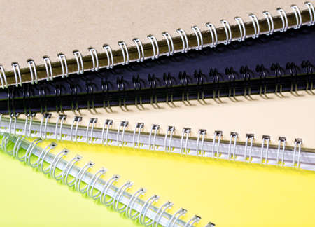 Stack of colorful notebooks with spiral edge, school or educational backgroundの写真素材