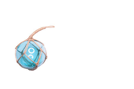 Glass fishing net round buoy. One glass sphere with ropes isolated on white background. Scandinavian...