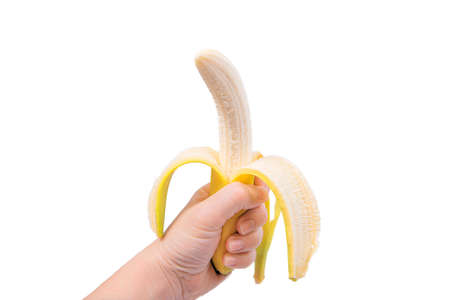 Fresh open yellow banana in hand isolated on whiteの写真素材