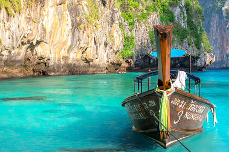 Phi-Phi, Thailand - February 13, 2018: Scenery Thailand islands view with colorful thai boat on sea coast. Beach resort exotic sea journey.のeditorial素材