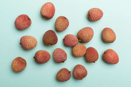 Lychee fruit on color background. Top view, flat lay.の写真素材