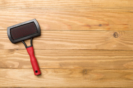 Pet brush on wooden background.の写真素材