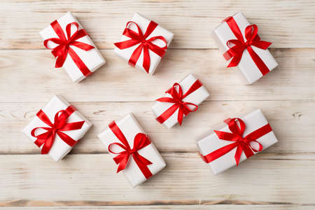 Top view of gift boxes on wooden background.の写真素材