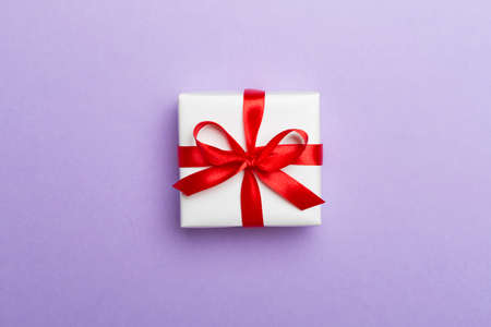Top view of gift box on color background.の写真素材