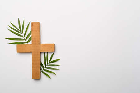 Palm branches and cross on white background, top view. Palm sunday concept.の写真素材