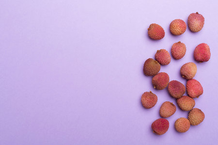 Lychee fruit on color background. Top view, flat lay.の写真素材
