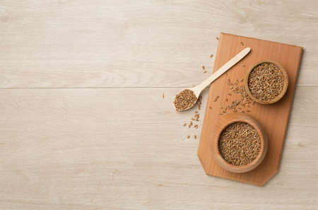 Wholegrain spelt farro in bowl on wooden background. top view.の写真素材