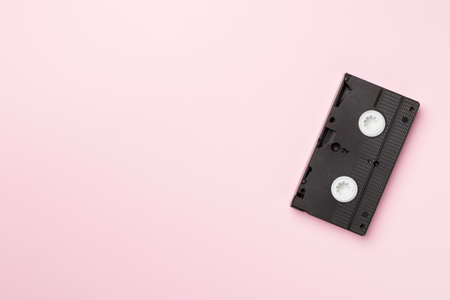Old analog tape VHS cassette on color background, top view.の写真素材