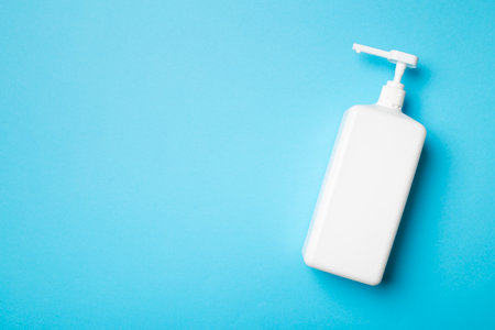 Hand sanitizer in white bottle on color background.の写真素材