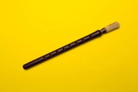 Armenian national musical instrument duduk on color background. top view.の写真素材